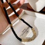 MAYTRENDS  -  High-end black disc beaded necklace for women with niche design metal splicing clavicle chain